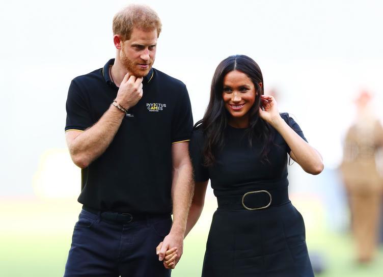 Outdoor picnic: Prince Harry and Meghan Markle with son Archie at a family barbecue