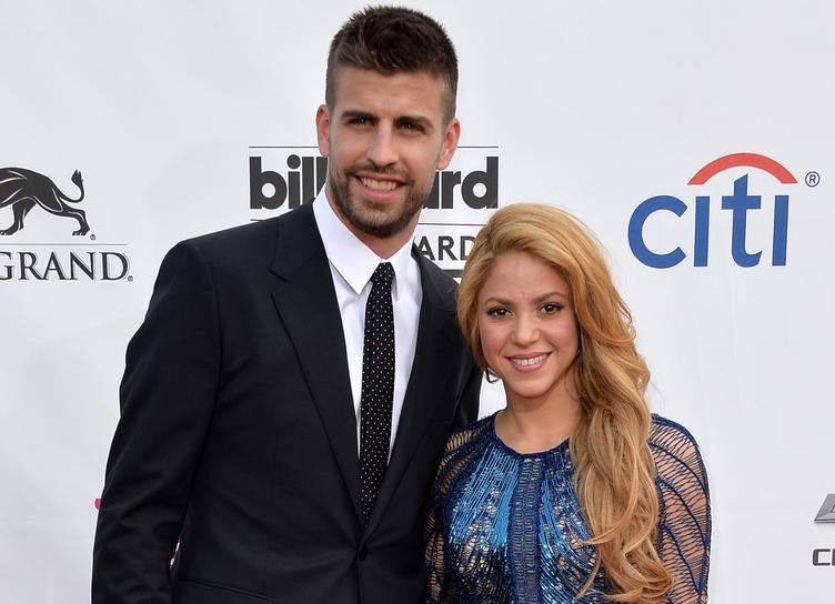 As fans boo Gerard Pique during a match, Shakira sunbathes on the beach in Mexico with her children