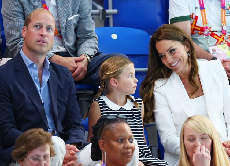 Royal sport: Prince William and Kate Middleton with daughter Charlotte in swimming competitions